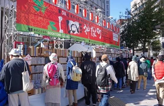 Sidewalk book carts lined up along Yasukuni-dori in Jimbocho