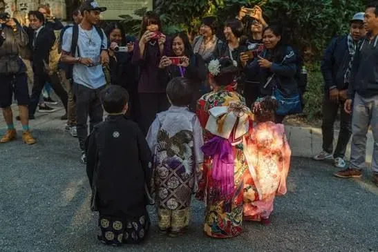 Young children dressed in traditional kimono visiting Hie Shrine for Shichi-Go-San